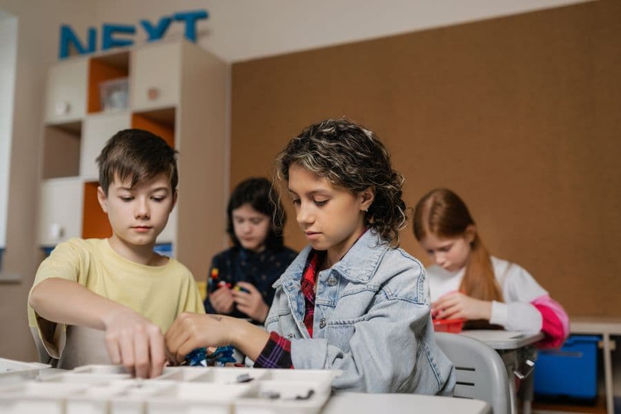 School children doing a hands-on technology workshop
