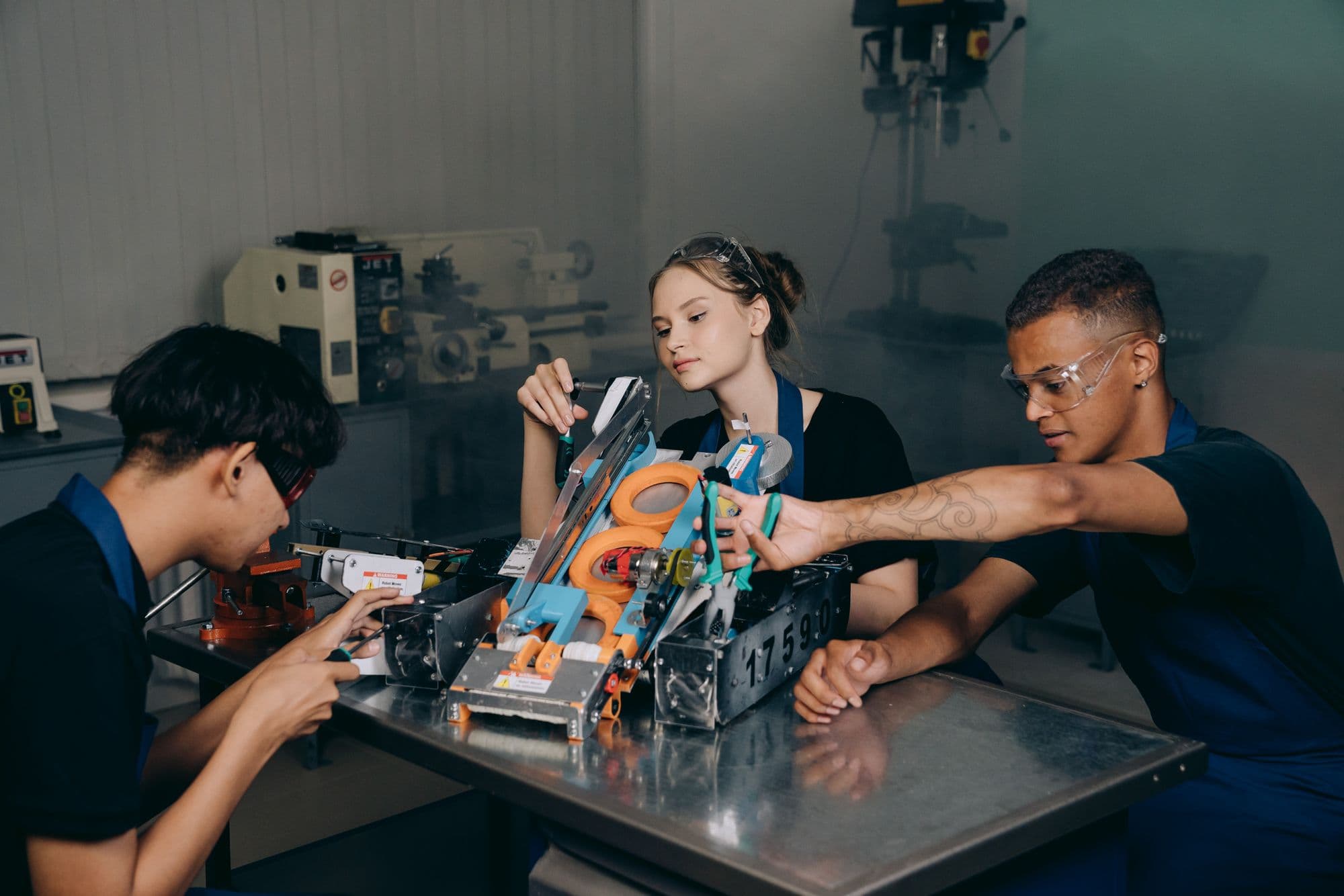Engineering students working on robotics in a college lab