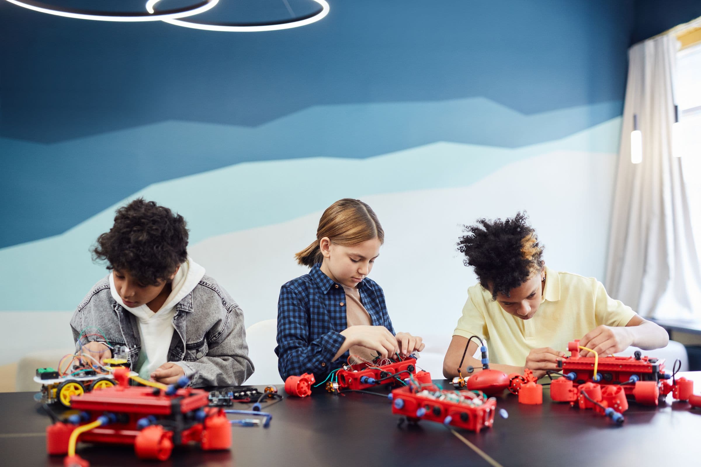 Students building a robot at the GenixoTech robotics bootcamp