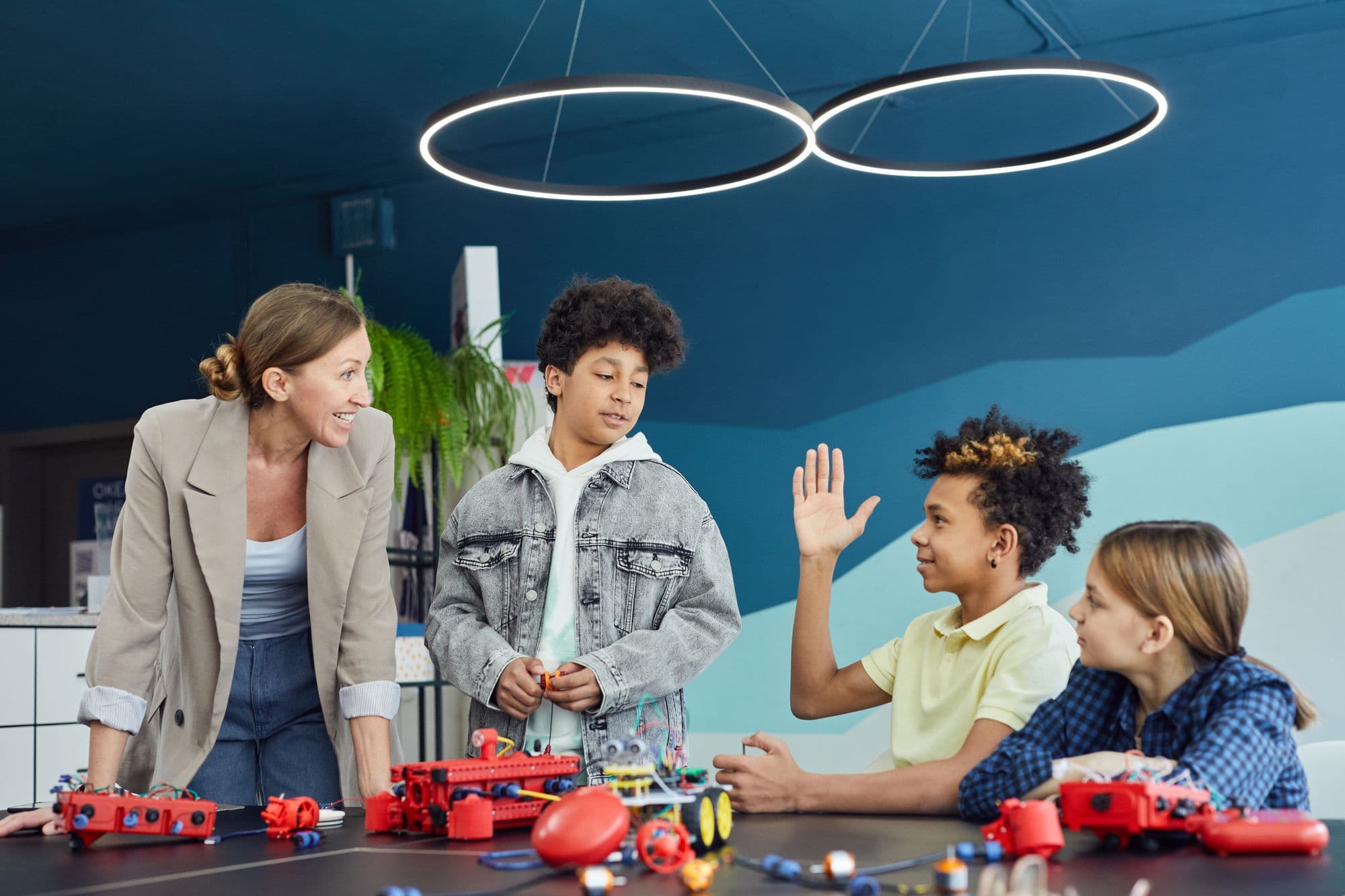 School students learning robotics and coding in a classroom